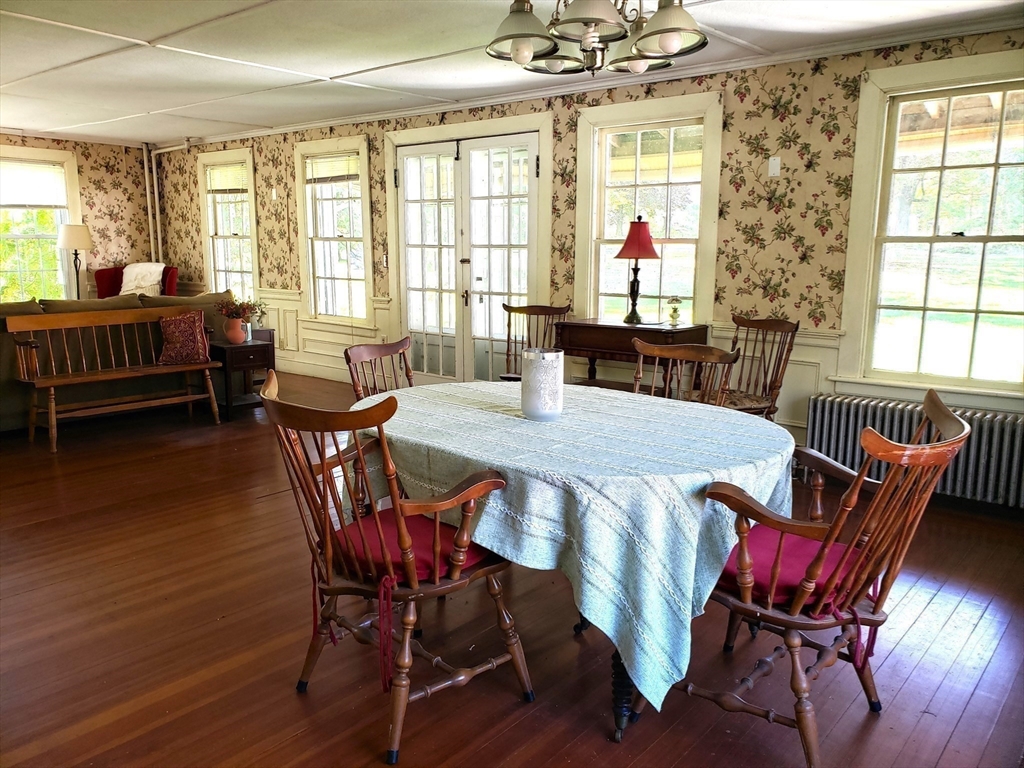 1 Searle Road Huntington, MA 01050 - Photo 16 of 42 a view of a dining room with furniture window and wooden floor