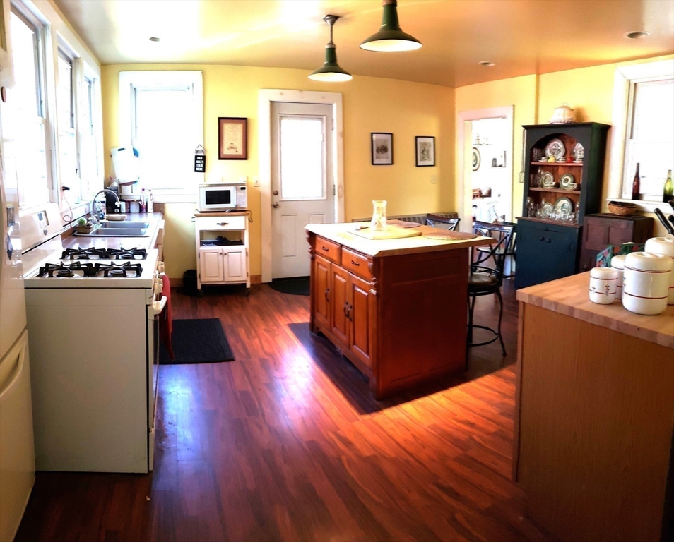 1 Searle Road Huntington, MA 01050 - Photo 23 of 42 a kitchen with stainless steel appliances a stove top oven and a refrigerator