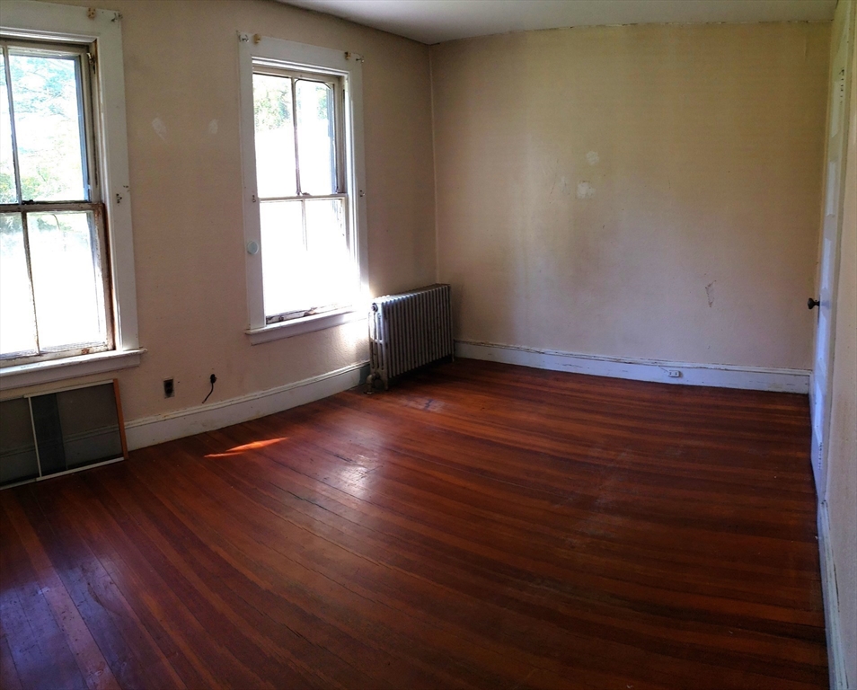 1 Searle Road Huntington, MA 01050 - Photo 32 of 42 an empty room with wooden floor and windows