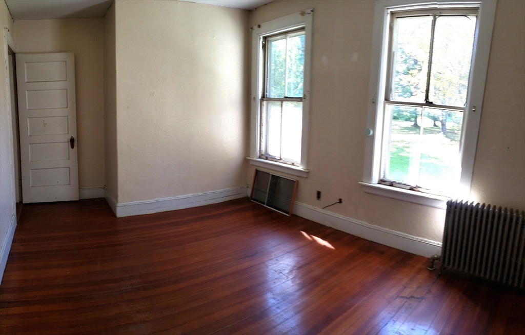 1 Searle Road Huntington, MA 01050 - Photo 33 of 42 an empty room with wooden floor and windows