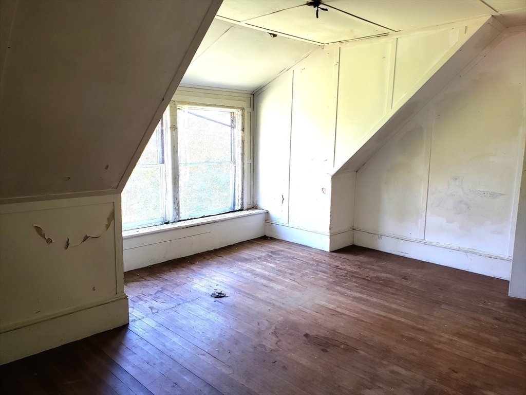 1 Searle Road Huntington, MA 01050 - Photo 40 of 42 a view of an empty room with wooden floor and fan