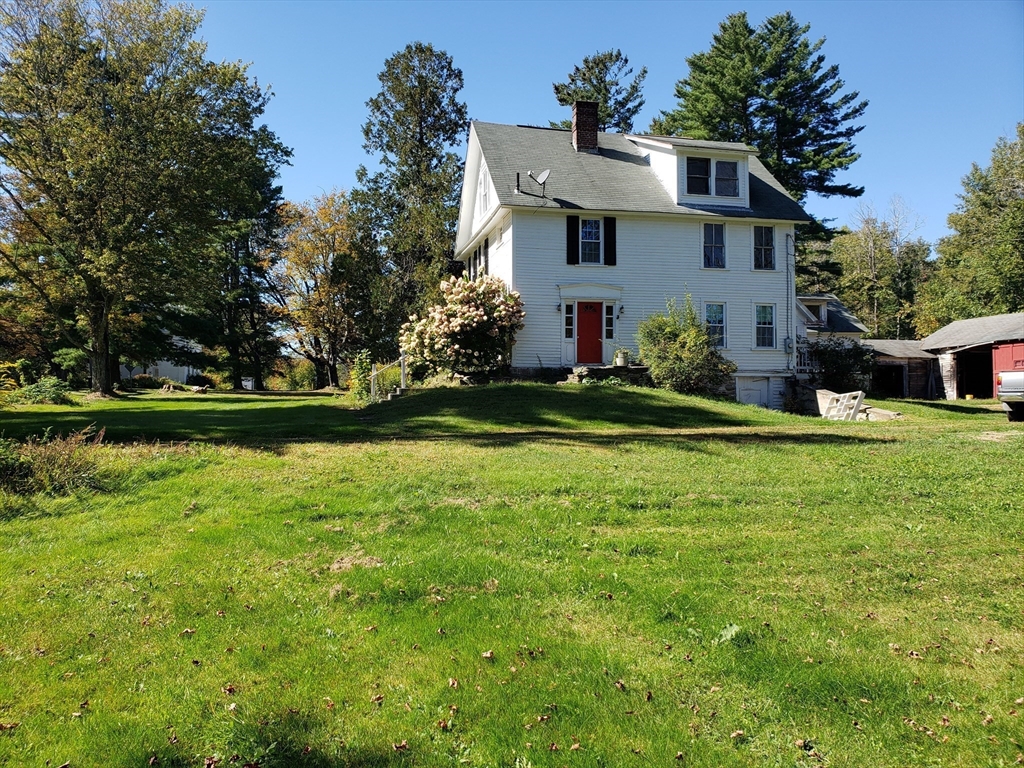 1 Searle Road Huntington, MA 01050 - Photo 4 of 42 a front view of house with garden and trees