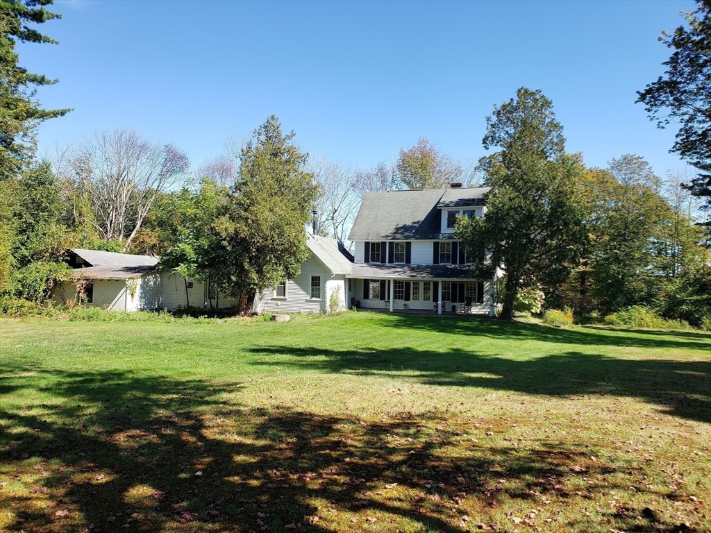 1 Searle Road Huntington, MA 01050 - Photo 9 of 42 a front view of a house with a yard