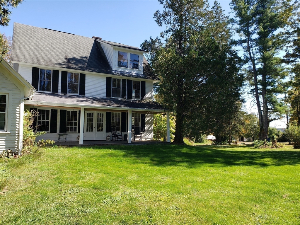1 Searle Road Huntington, MA 01050 - Photo 10 of 42 a view of a building with a yard
