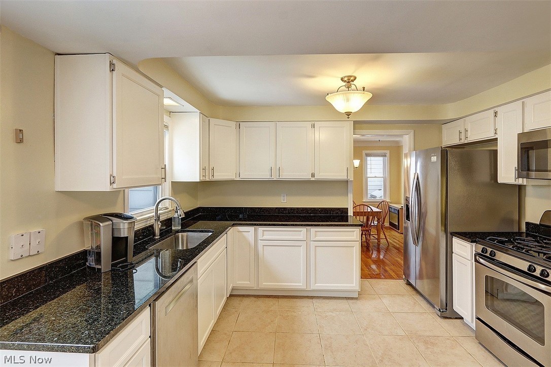 4457 Groveland Road University Heights, OH 44118 - Photo 10 of 24 The kitchen has been nicely updated with younger cabinets, stainless appliances and granite counters.