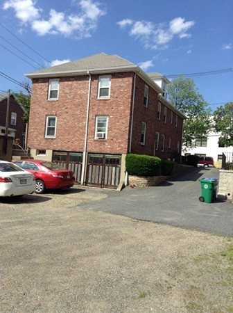 151 Adams Street Newton, MA 02458 - Photo 3 of 4 a view of a car park in front of house