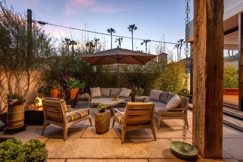 a large kitchen with a large window and cabinets
