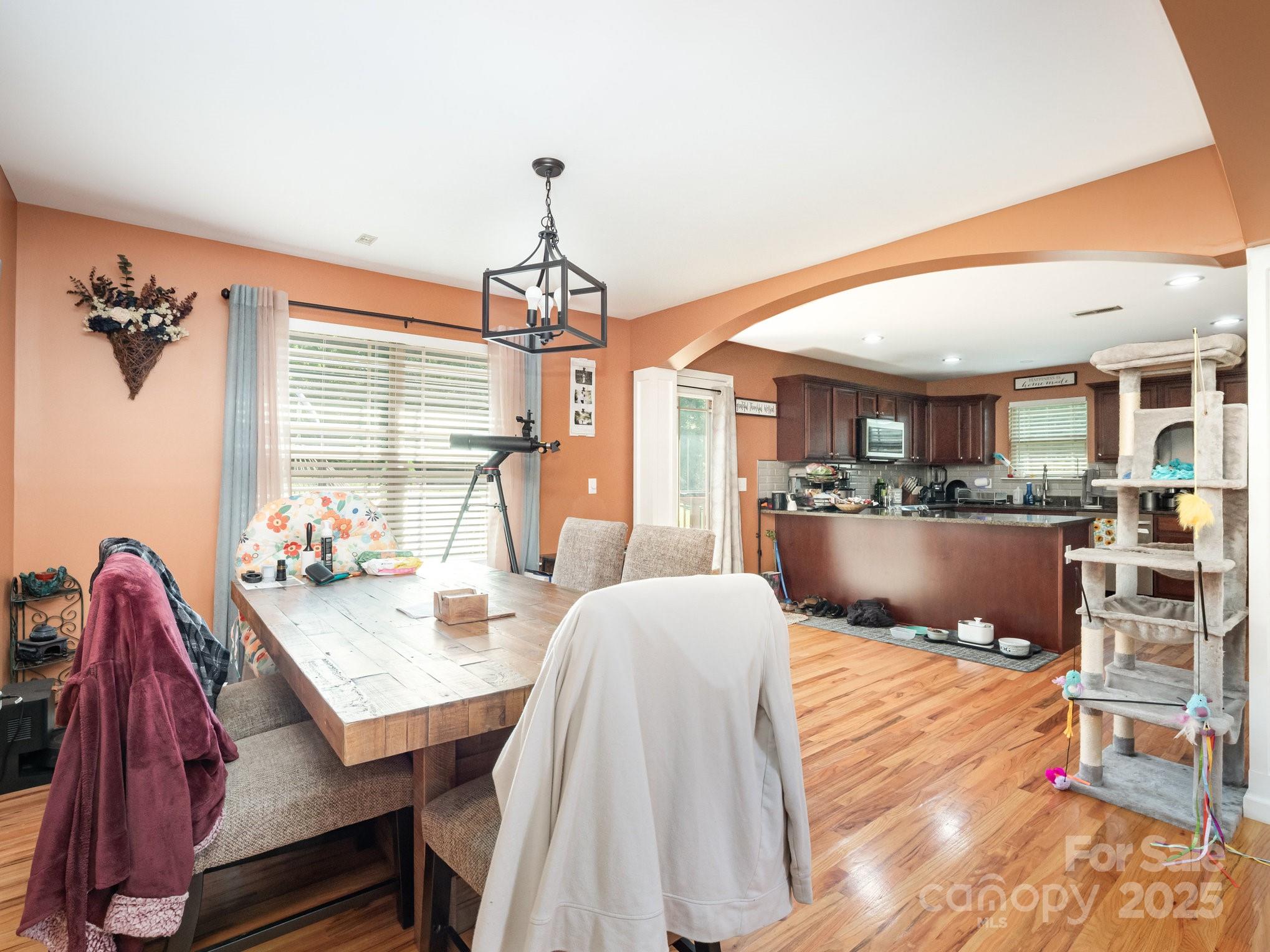 190 Glendower Lane Chesnee, SC 29323 - Photo 11 of 29 a living room with furniture a chandelier and a dining table