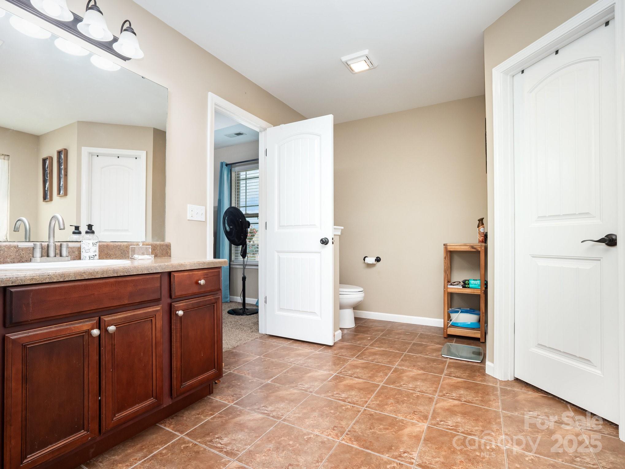 190 Glendower Lane Chesnee, SC 29323 - Photo 22 of 29 a spacious bathroom with a sink and a mirror