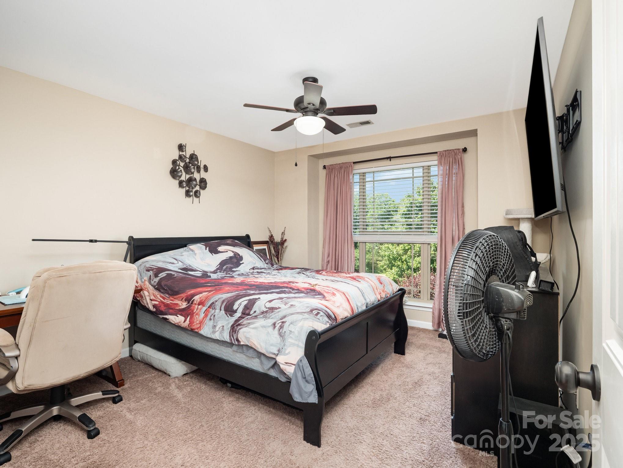 190 Glendower Lane Chesnee, SC 29323 - Photo 23 of 29 a bedroom with a bed chairs and window