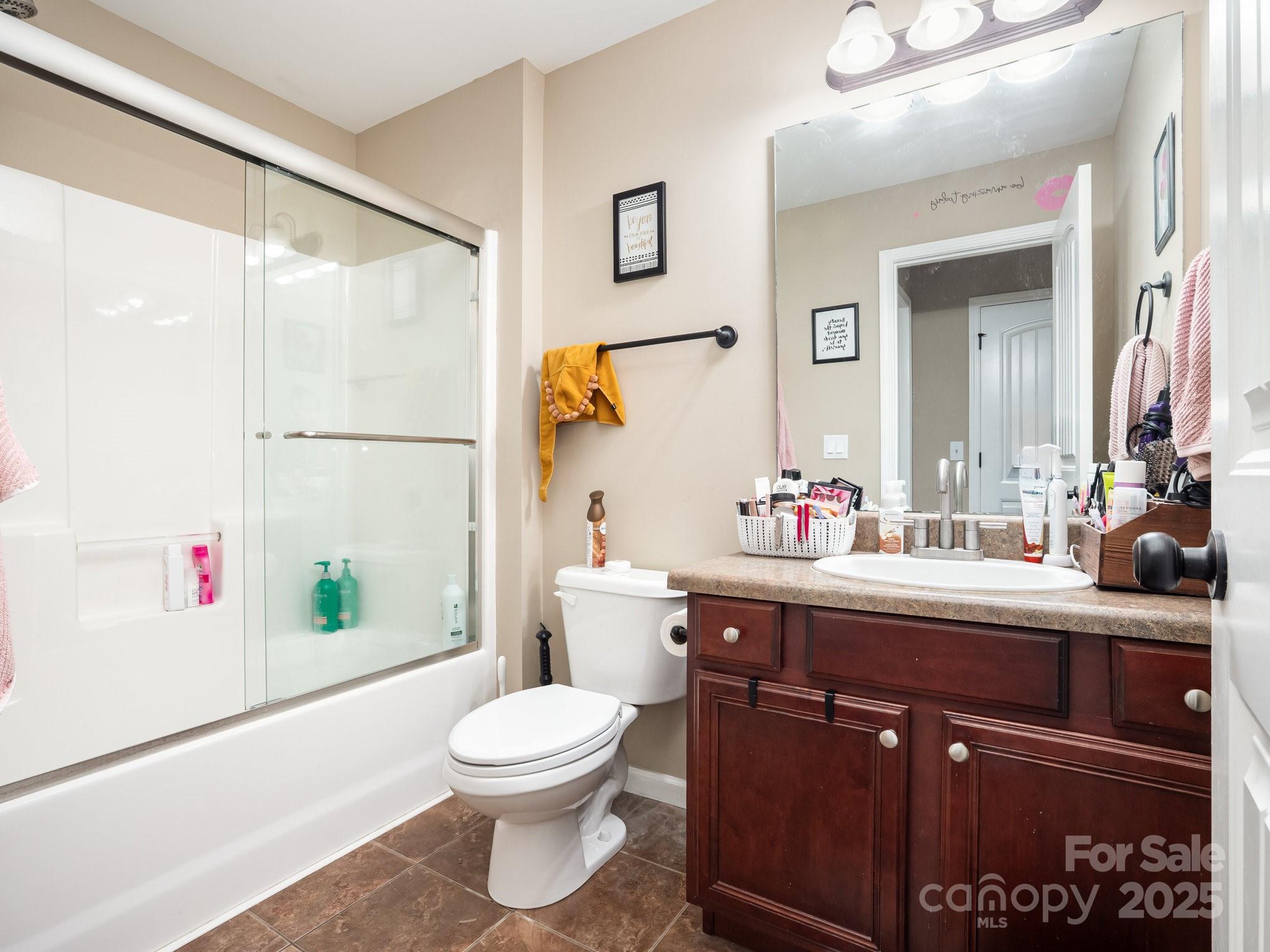 190 Glendower Lane Chesnee, SC 29323 - Photo 25 of 29 a bathroom with a toilet a sink and a mirror