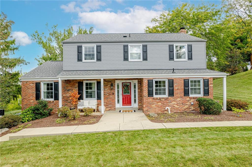 a front view of house with yard outdoor seating and garden