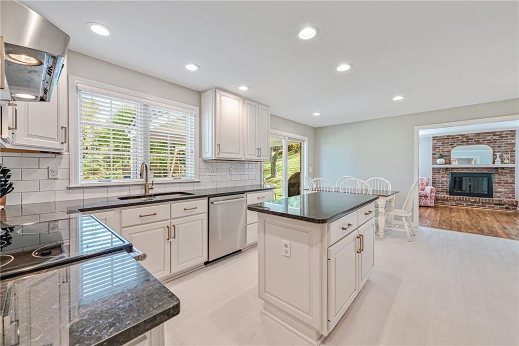 103 Lexington Drive Canonsburg, PA 15317 - Photo 22 of 44 a kitchen with granite countertop a sink and a stove top oven