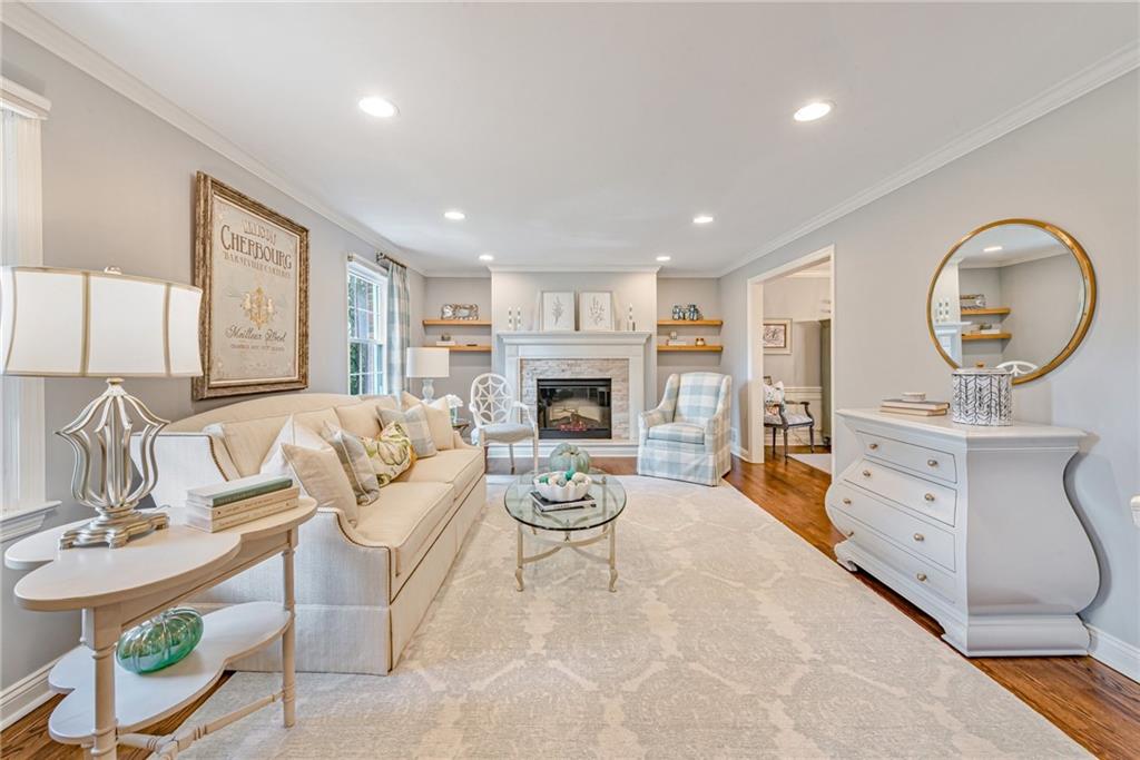103 Lexington Drive Canonsburg, PA 15317 - Photo 3 of 44 a living room with furniture a fireplace and a flat screen tv