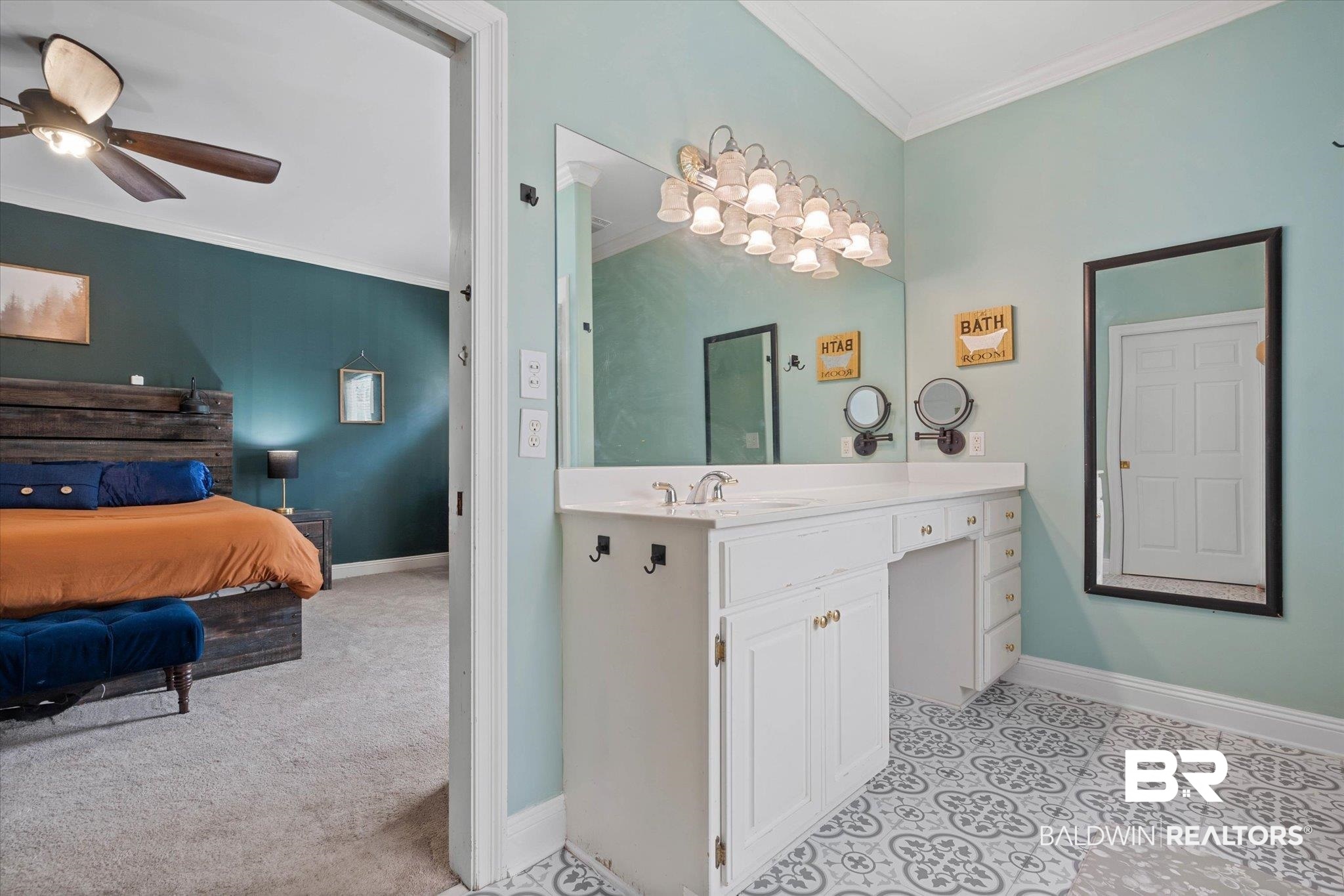 22760 Ridgewood Drive Robertsdale, AL 36567 - Photo 15 of 44 Ensuite bathroom featuring ornamental molding, ceiling fan, and vanity