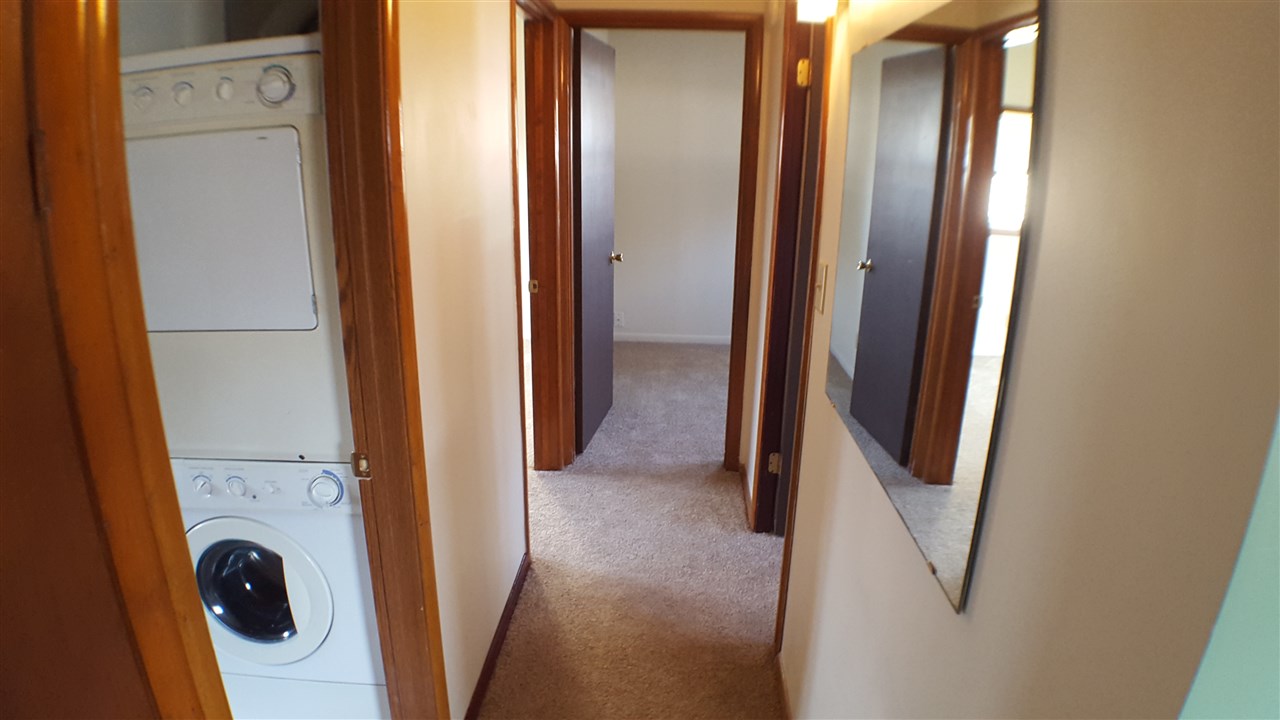 7608 Randy Road Machesney Park, IL 61115 - Photo 8 of 20 a view of a storage and utility room with washer and dryer