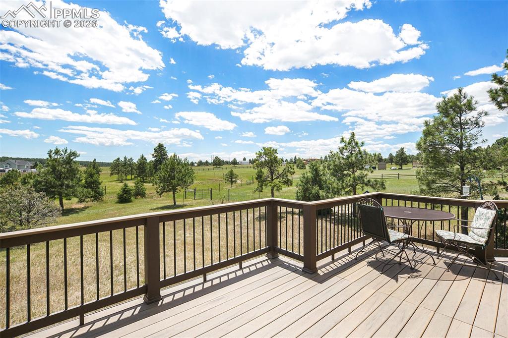 2585 Mohawk Way Monument, CO 80132 - Photo 19 of 49 a view of balcony with wooden floor and fence