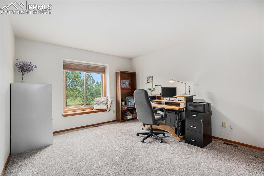 2585 Mohawk Way Monument, CO 80132 - Photo 26 of 49 a view of a workspace with furniture and a window