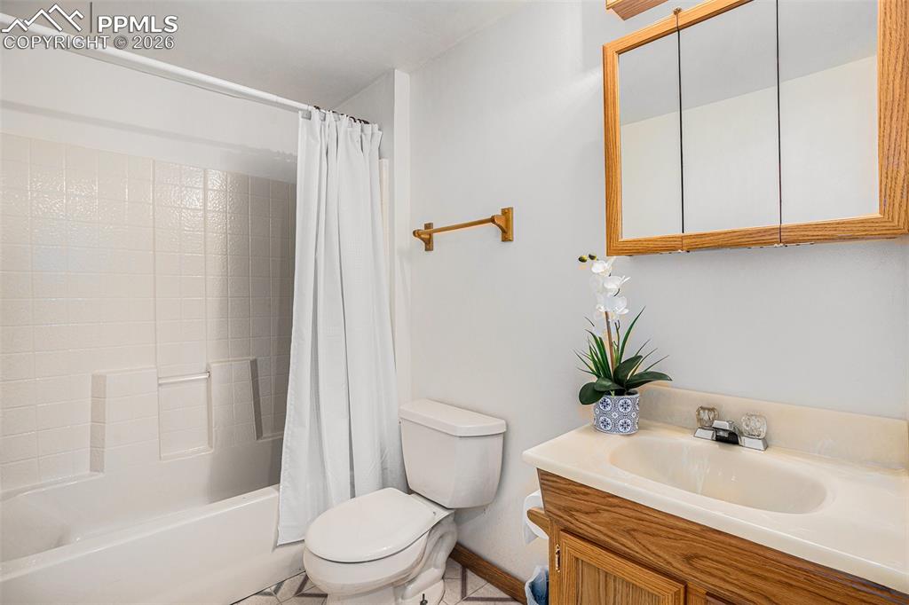 2585 Mohawk Way Monument, CO 80132 - Photo 28 of 49 a bathroom with a sink a toilet a tub and shower