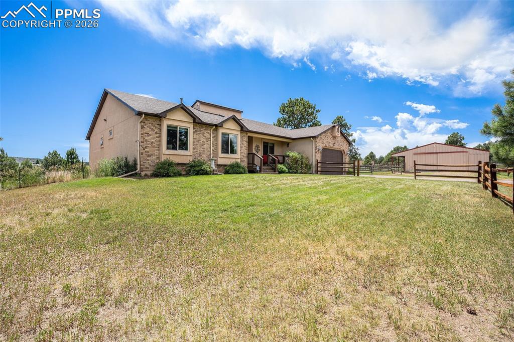 2585 Mohawk Way Monument, CO 80132 - Photo 45 of 49 a view of a house with a yard