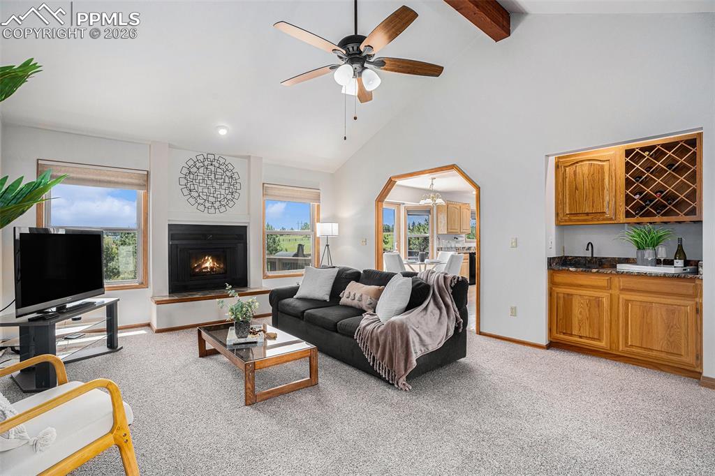 2585 Mohawk Way Monument, CO 80132 - Photo 7 of 49 a living room with furniture fireplace and flat screen tv