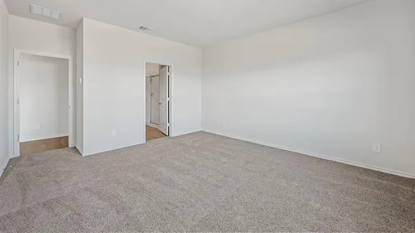 a view of an empty room and entryway