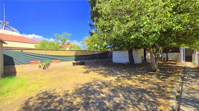 a view of a yard with an outdoor space