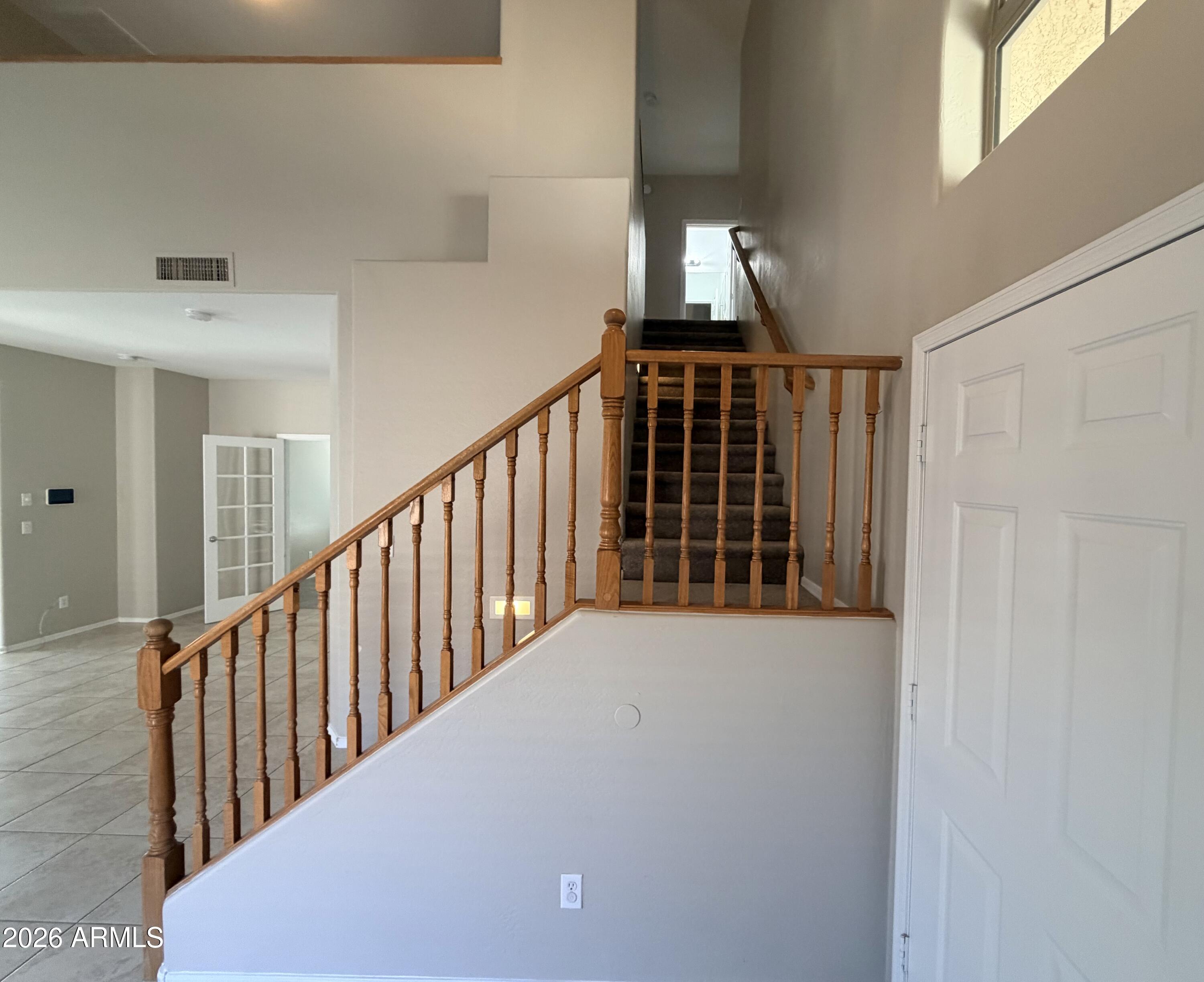 191 West Rio Drive Casa Grande, AZ 85122 - Photo 13 of 34 a view of staircase with railing and white walls