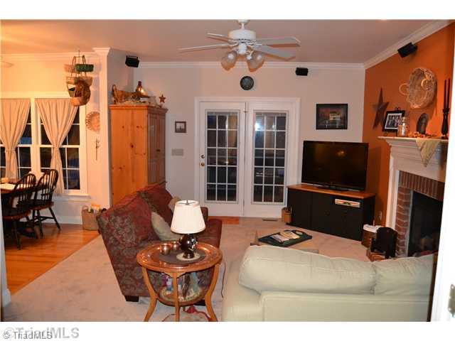 7497 Bethel View Court Oak Ridge, NC 27310 - Photo 5 of 16 Den/Family/Great Room. OPEN TO KITCHEN AND ACCESS TO SCREENED DECK