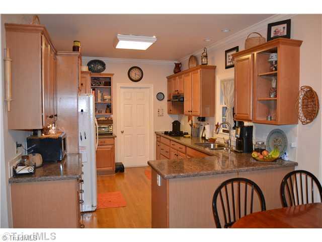 7497 Bethel View Court Oak Ridge, NC 27310 - Photo 7 of 16 Kitchen. NEW QUARTZ COUNTERTOPS