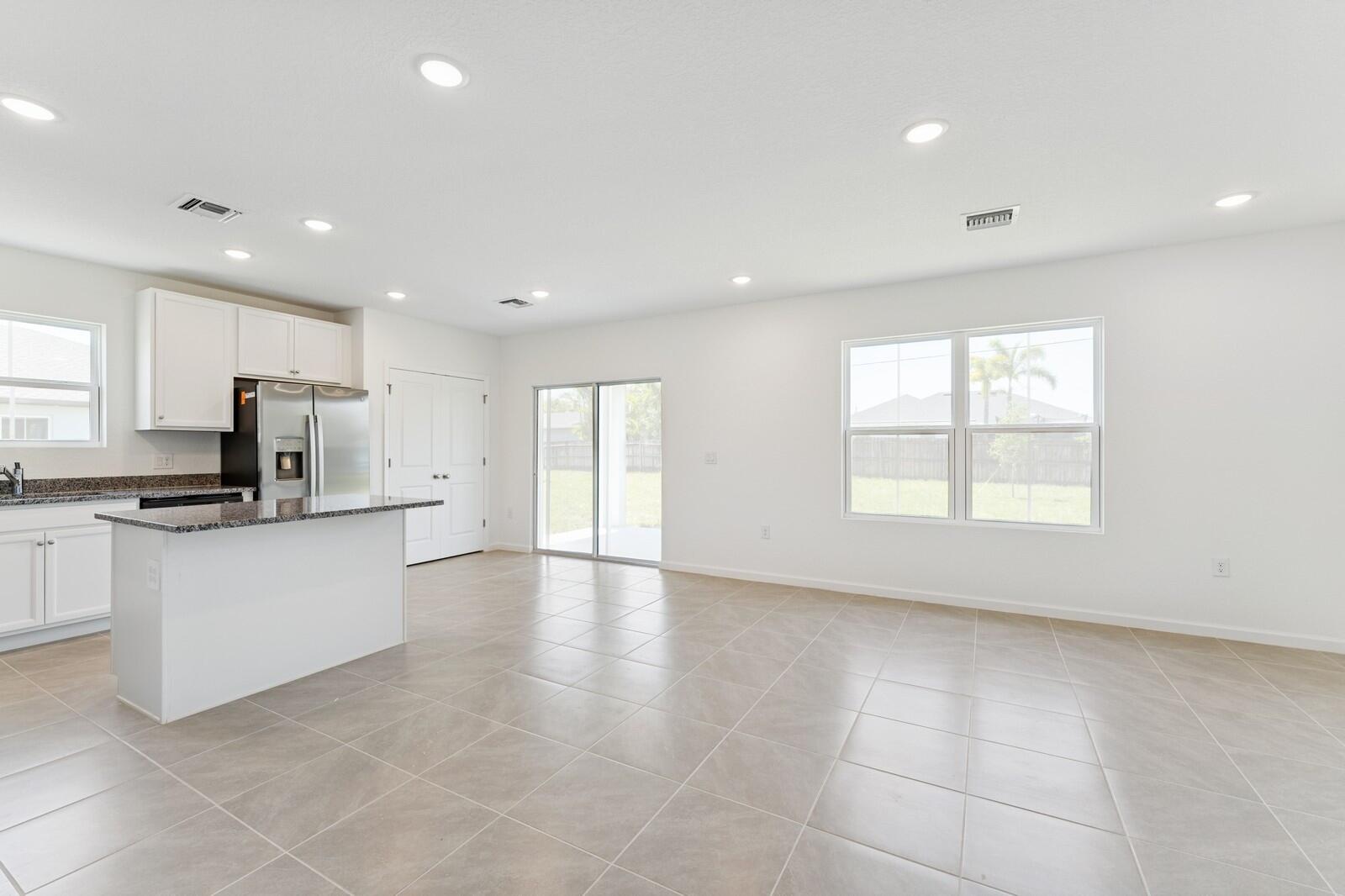 322 Southwest Becker Road, Unit 13 Port St. Lucie, FL 34953 - Photo 14 of 35 Kitchen, Great Room & Dining Area