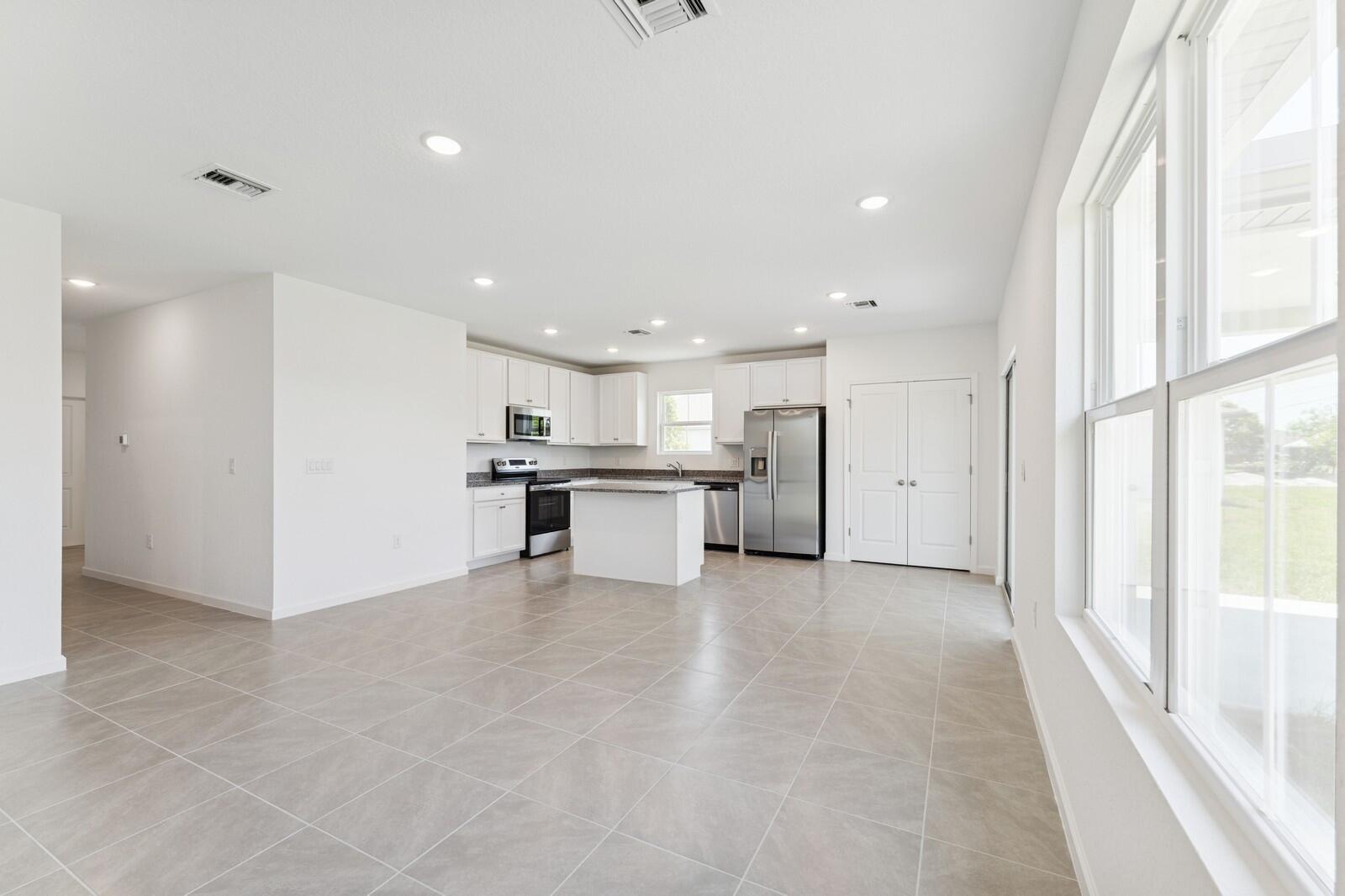 322 Southwest Becker Road, Unit 13 Port St. Lucie, FL 34953 - Photo 15 of 35 Kitchen, Great Room & Dining Area