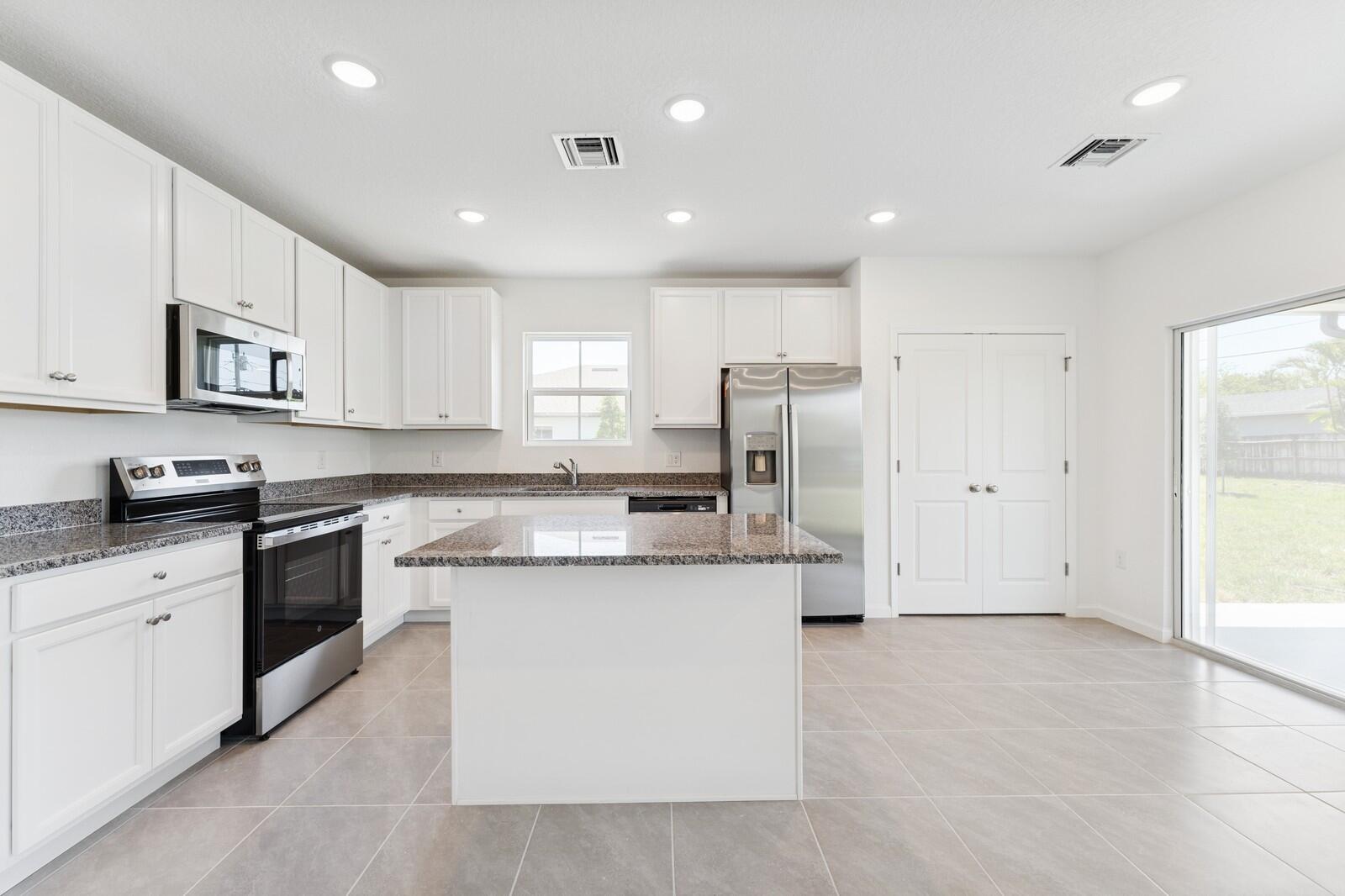 322 Southwest Becker Road, Unit 13 Port St. Lucie, FL 34953 - Photo 16 of 35 Kitchen & Dining Area