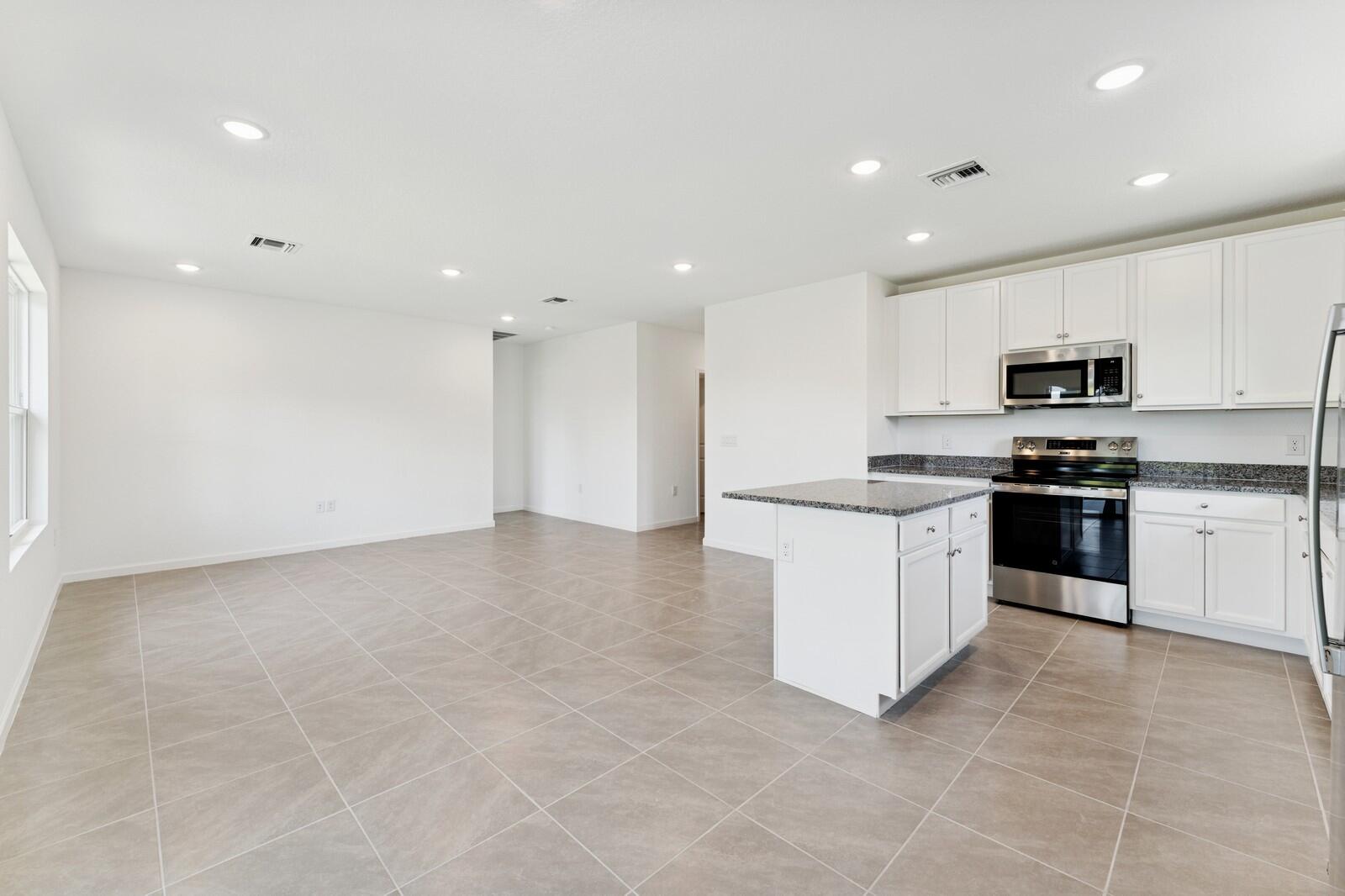 322 Southwest Becker Road, Unit 13 Port St. Lucie, FL 34953 - Photo 20 of 35 Kitchen, Great Rm & Dining Area
