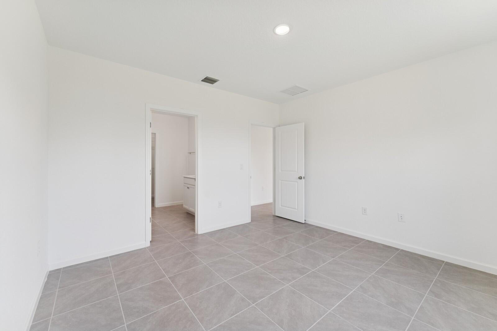 322 Southwest Becker Road, Unit 13 Port St. Lucie, FL 34953 - Photo 22 of 35 Primary Suite