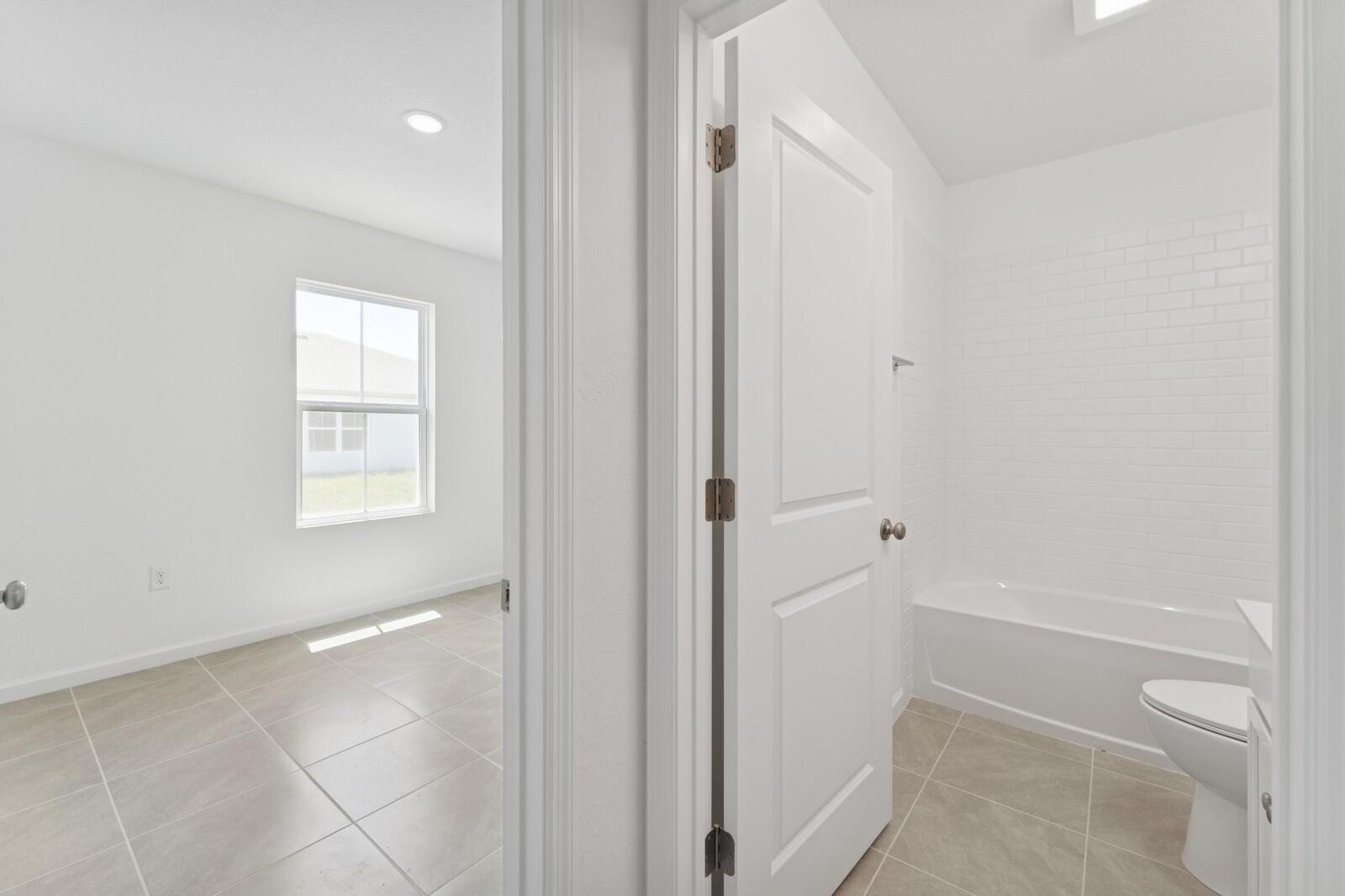 322 Southwest Becker Road, Unit 13 Port St. Lucie, FL 34953 - Photo 8 of 35 Hall Bath & Bedroom 3