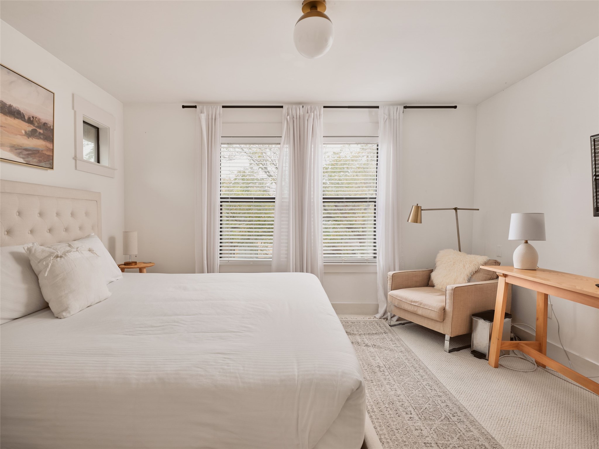 2002 East 13th Street, Unit A Austin, TX 78702 - Photo 21 of 37 Bedroom with light colored carpet and baseboards