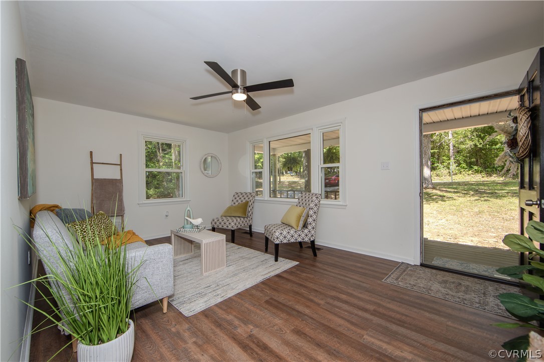 20104 Shippings Road Dewitt, VA 23840 - Photo 5 of 24 a living room with furniture floor to ceiling window and wooden floor