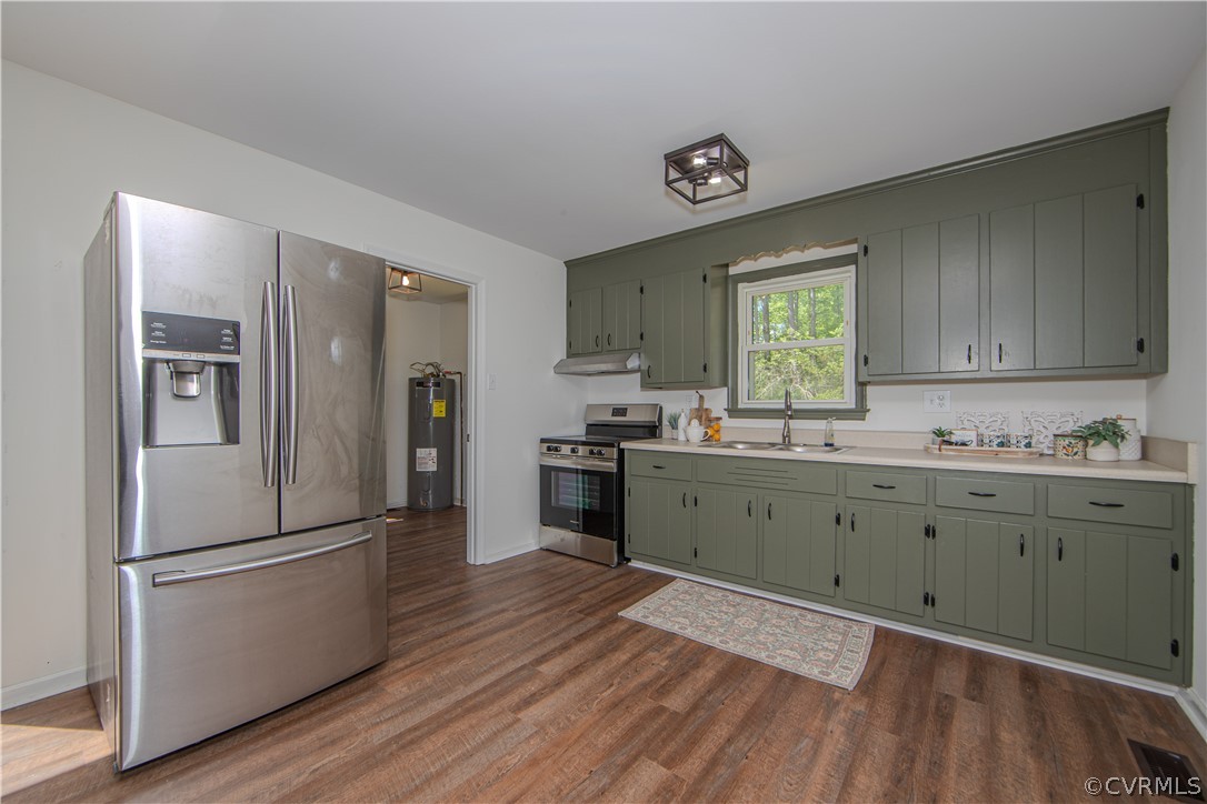 20104 Shippings Road Dewitt, VA 23840 - Photo 7 of 24 a kitchen with granite countertop a refrigerator stove and sink