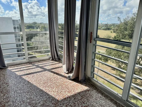 a view of a door and a window