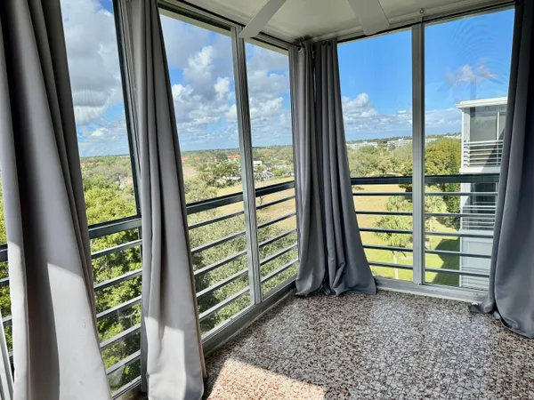 a view of a room that has a large window