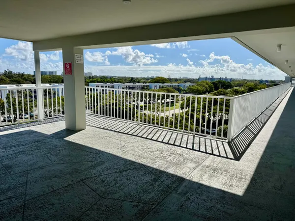 a view of balcony with wooden floor