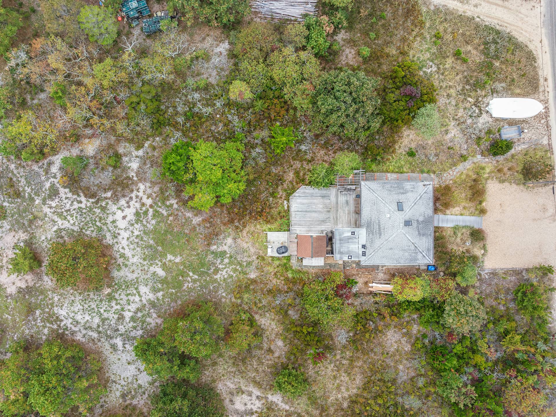 203 Shore Road Amagansett, NY 11930 - Photo 17 of 20 an aerial view of a house with yard and trees all around