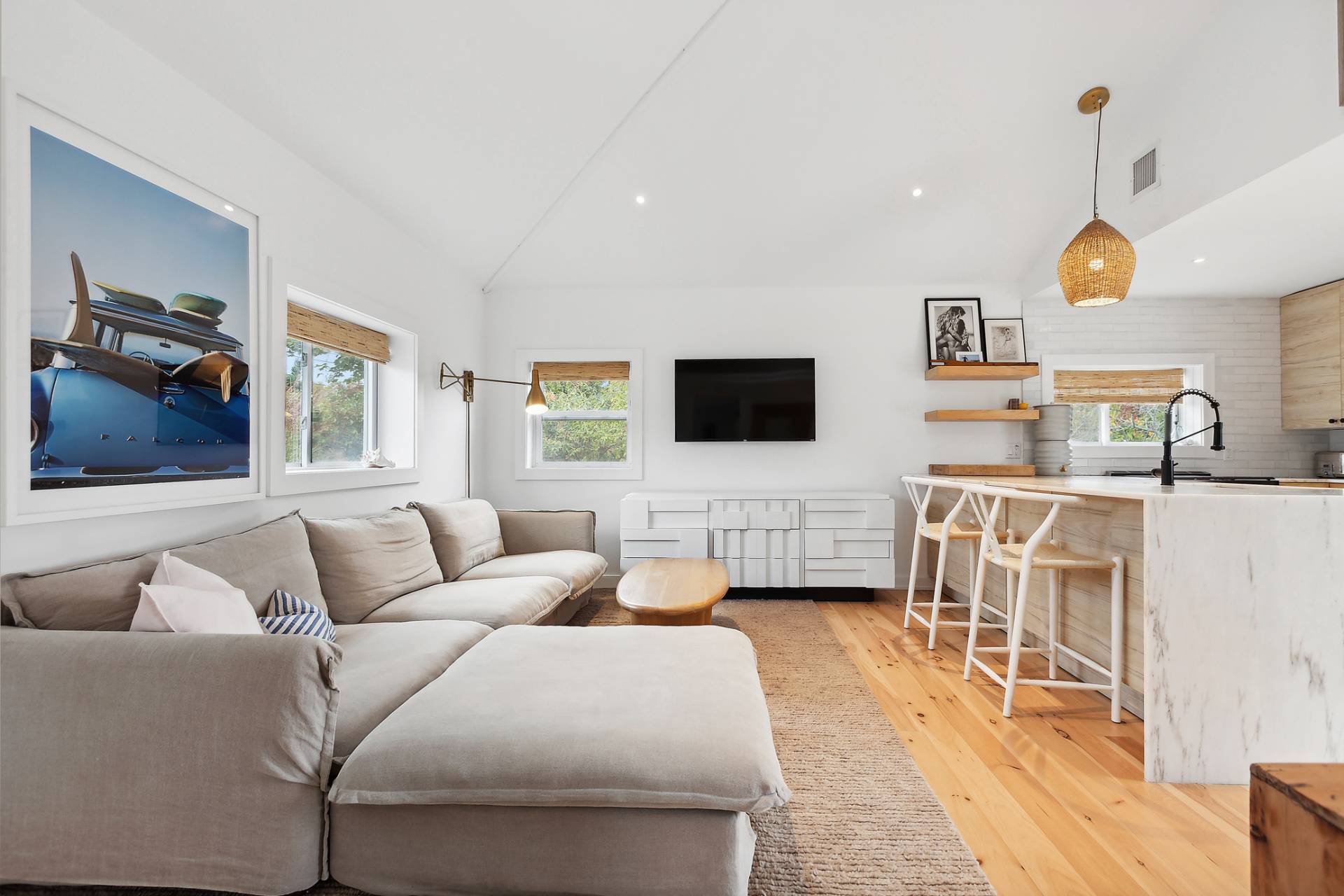 203 Shore Road Amagansett, NY 11930 - Photo 2 of 20 a living room with furniture and a flat screen tv