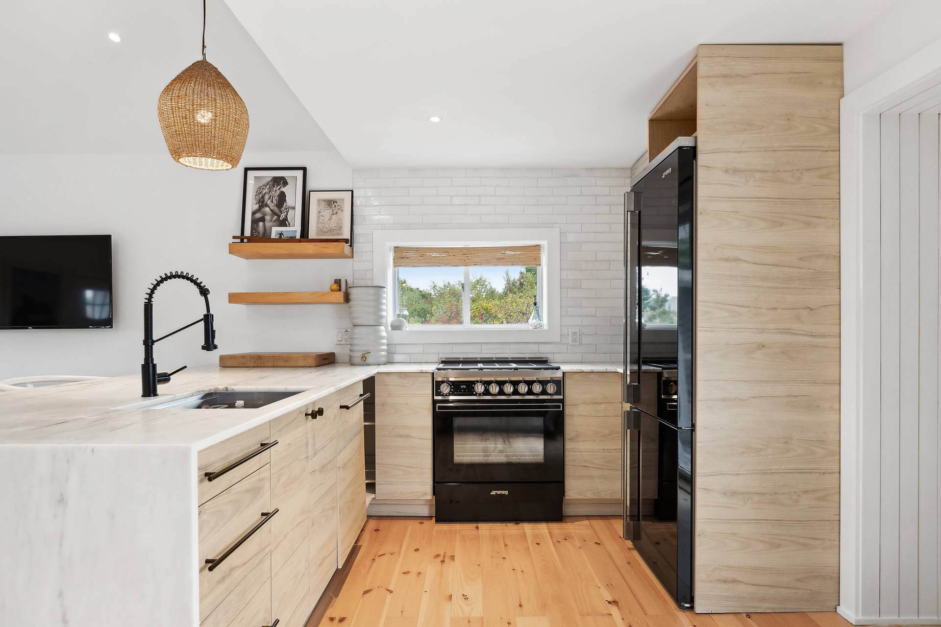 203 Shore Road Amagansett, NY 11930 - Photo 4 of 20 a kitchen with a stove a sink and a microwave