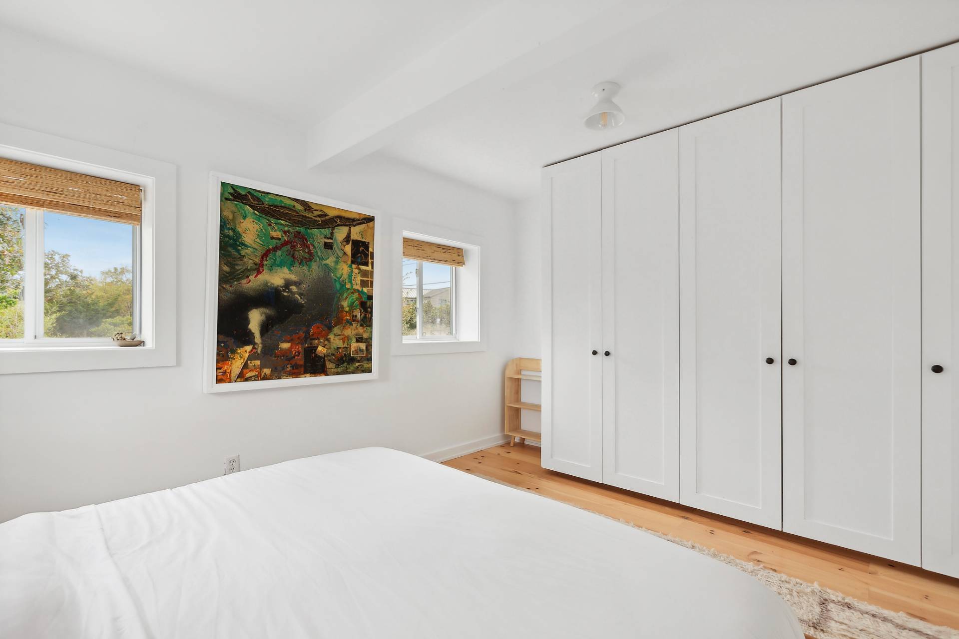 203 Shore Road Amagansett, NY 11930 - Photo 6 of 20 a bedroom with a bed and a window