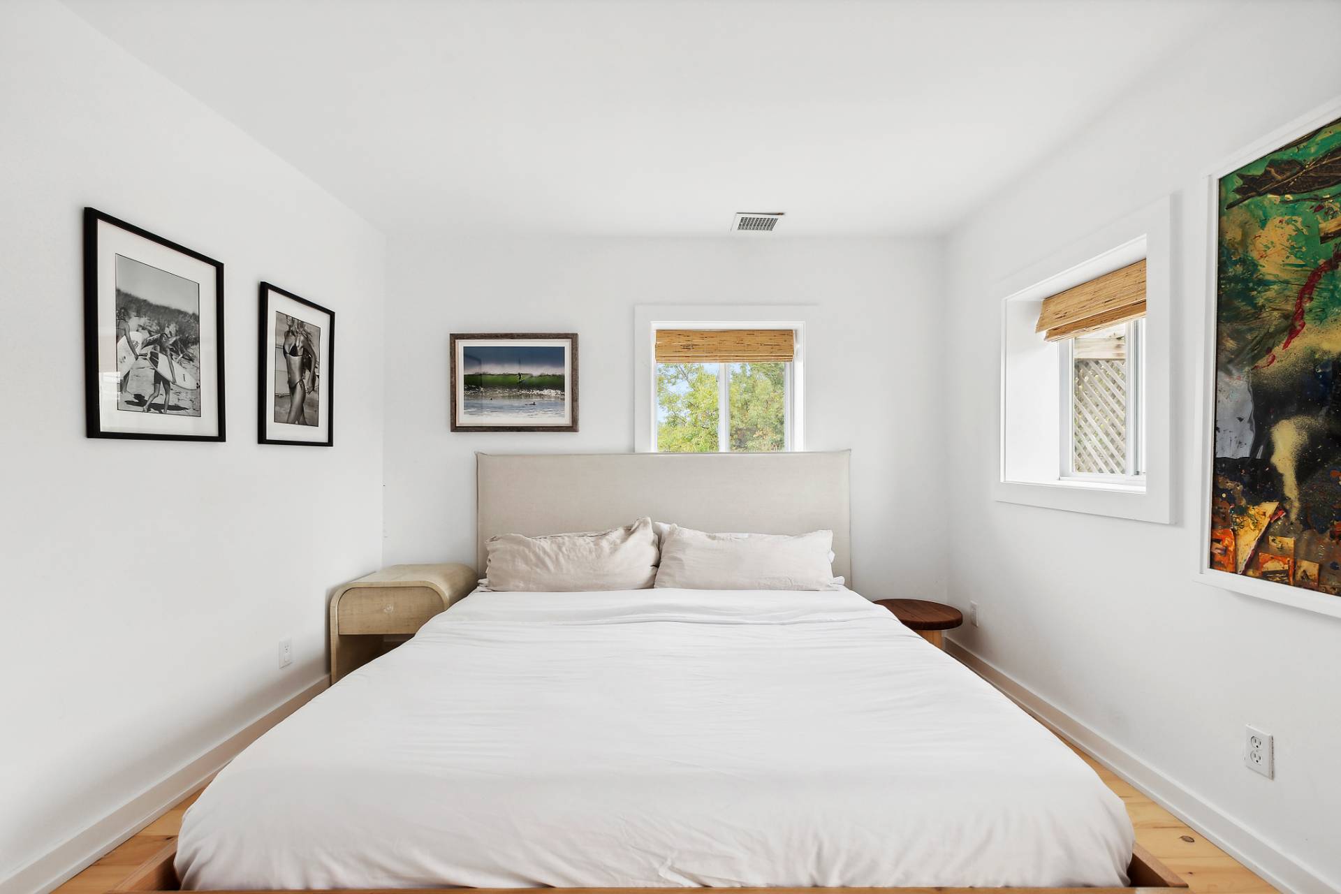 203 Shore Road Amagansett, NY 11930 - Photo 7 of 20 a bedroom with a large bed and a window