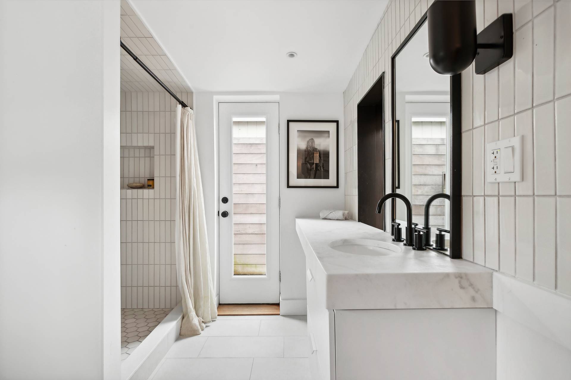 203 Shore Road Amagansett, NY 11930 - Photo 8 of 20 a kitchen with a sink a stove and a refrigerator