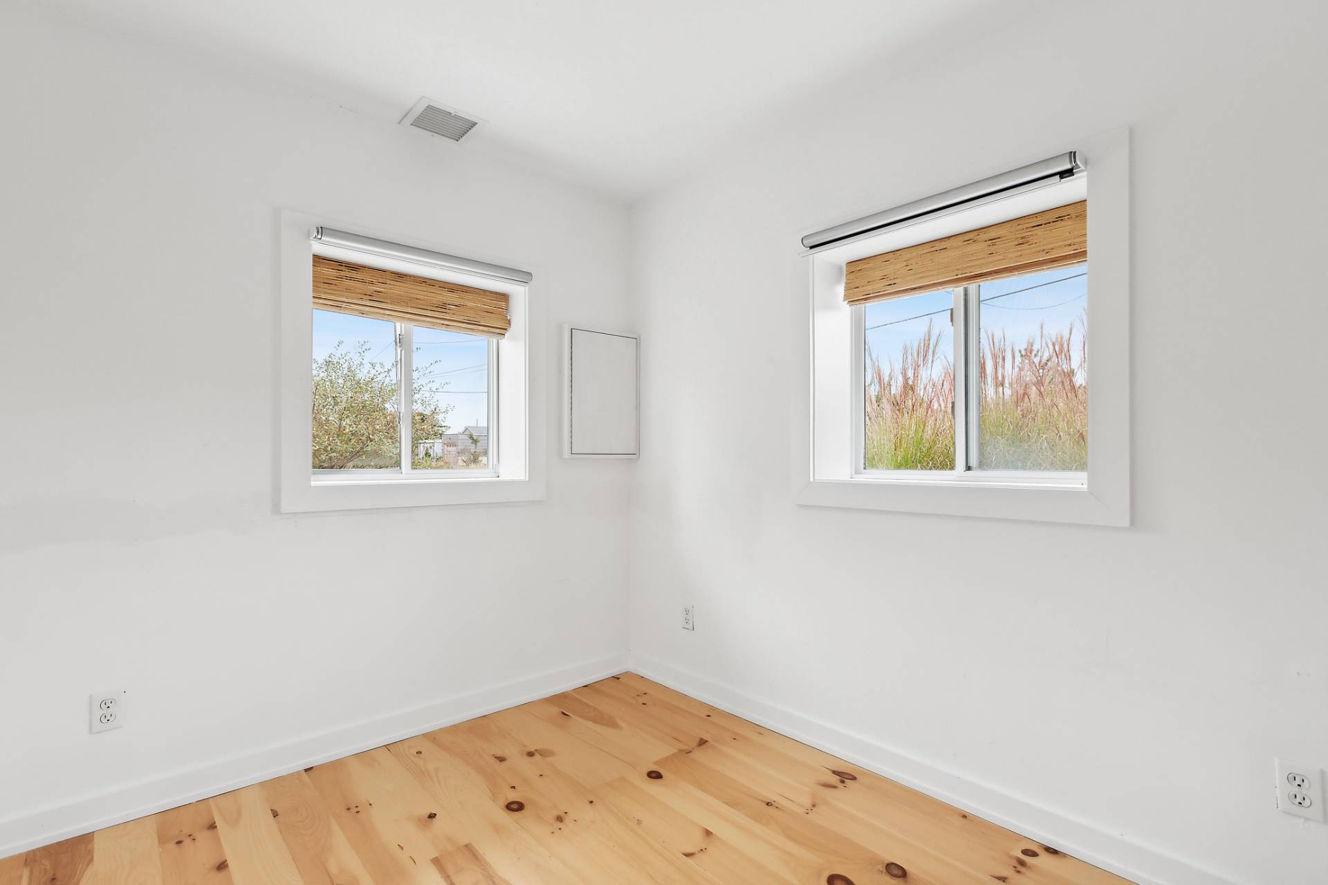 203 Shore Road Amagansett, NY 11930 - Photo 9 of 20 an empty room with a window
