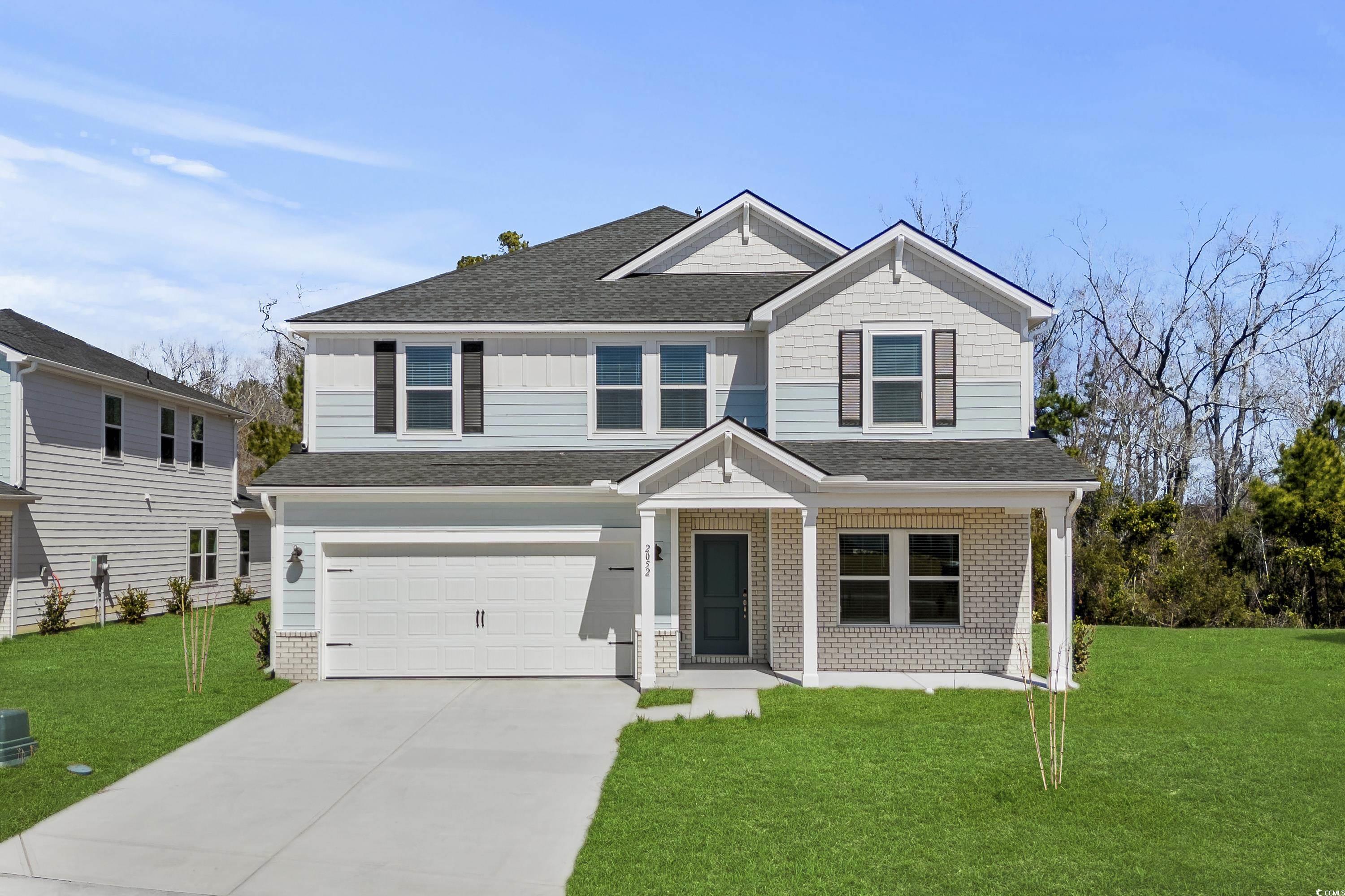 2052 Copper Crk Loop Longs, SC 29568 - Photo 1 of 40 View of front facade with a garage, a front yard,